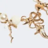 “abissi” chokerhalskæde i metal og raffia, guld “abissi” chokerhalskæde i metal og raffia, guld