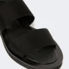 Flade sandaler i læder og elastisk bånd, sort Flade sandaler i læder og elastisk bånd, sort