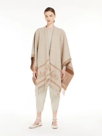 Poncho i jacquarduld, beige Poncho i jacquarduld, beige