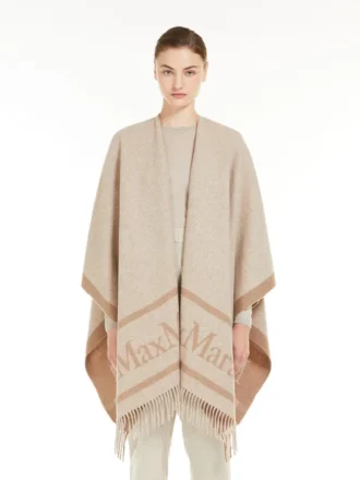 Poncho i jacquarduld, beige Poncho i jacquarduld, beige