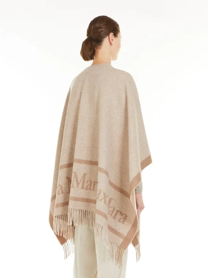 Poncho i jacquarduld, beige Poncho i jacquarduld, beige