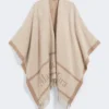 Poncho i jacquarduld, beige Poncho i jacquarduld, beige