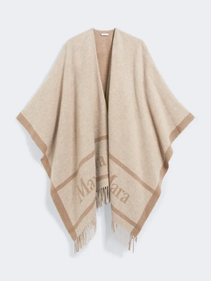 Poncho i jacquarduld, beige Poncho i jacquarduld, beige